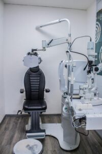 Well-equipped optometry clinic with advanced examination chair and diagnostic equipment.
